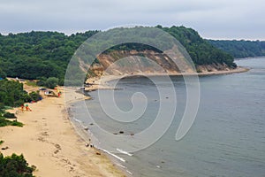 View of the cliffs, sandy beach and a beautiful cove