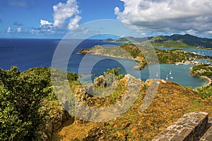 A view from the cliffs on Shirley Heights lookout towards English Harbour in Antigua photo