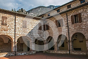 View of cloister in the historic center of Pioraco, Marche, Italy