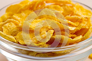 View close-up on a glass bowl with corn flakes