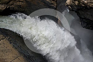 View closeup waterfall Trummelbach fall in mountains, valley of waterfalls