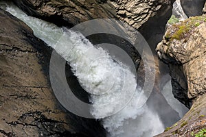 View closeup waterfall Trummelbach fall in mountains, valley of waterfalls