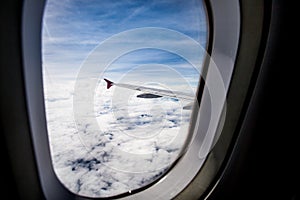 View of cloud sky and wing of airplane