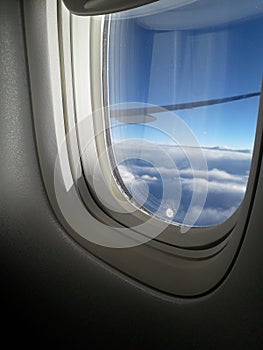 View of the clouds from a aeroplane window.