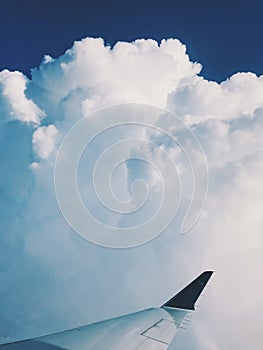 View of clouds from airplane seat