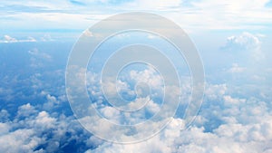 View of clouds while flying above the cloud