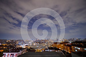 View of clouds over living apartment building in Turkey at night