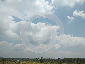 View of clouds over rice fields in rural areas