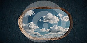 View of cloudy sky through a hole in a blue wall.
