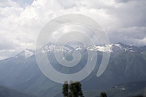 View of a cloudy valley in the Alps