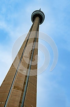 View of CN Tower from in Toronto over blue sky