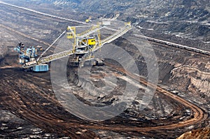 View into a coal mine with working weel excatator.