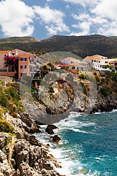 A view at coast of Asos village, Assos peninsula and fantastic turquoise and blue Ionian Sea water. Summer scenery of