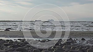 View from the coast on the high-speed Raketa hydrofoil ship and white cruise ship going across the Gulf of Finland