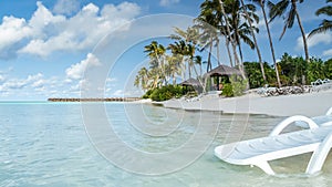 View of the coast of irufushi island, water bungalows, maldives