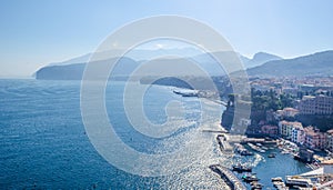 view of coast of italian city sorrento where people may relay on a wooden quay offseting sandy beach....IMAGE