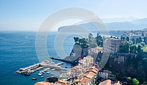 view of coast of italian city sorrento where people may relay on a wooden quay offseting sandy beach....IMAGE