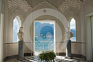 View on coast line of Lake Como, Italy, Lombardy region. Italian landscape view from Moorish Pavilion in Villa Melzi Garden famous