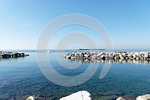 View from the coast of Livorno with the breakwater Diga della Vegliaia . Tuscany, Italy photo