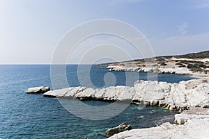 view of coastline and landmark big white chalk rock at Governor's beach,Limassol, Cyprus. Steep stone cliffs and