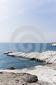 view of coastline and landmark big white chalk rock at Governor's beach,Limassol, Cyprus. Steep stone cliffs and