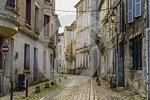 View of a cobblestone street with old buildings in Angouleme