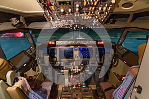 A view of the cockpit of a large commercial airplane a cockpit . Cockpit view of a aircraft cruising Control panel in a plane