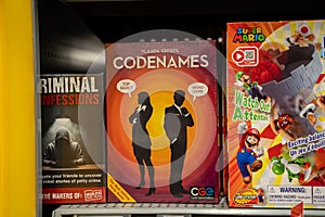 View of Codenames board game displayed on store shelf.