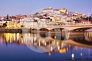 View Of Coimbra In Portugal And Mondego River At Night