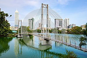 View of Colombo cityscape and skyscrapers with a bridge on Beira Lake a lake in the center of the city.