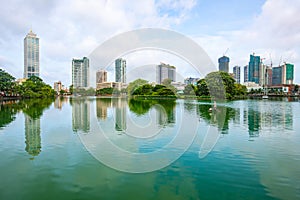 View of Colombo cityscape and skyscrapers reflection on Beira Lake a lake in the center of the city.