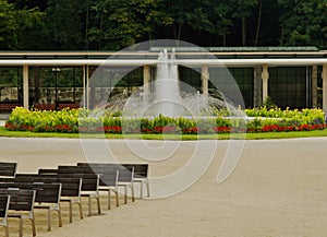 View of the colonnade with a fountain in the spa park
