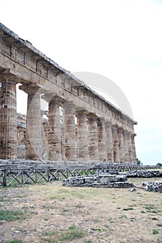 View of the colonnade and lateral entablature of the temple of Neptune, excavations of Paestum, Cilento, Campania, Italy photo