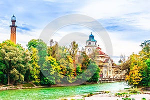 Colorful autumn landscape in front of Mueller Volksbad of Isar r photo