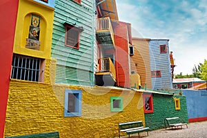 View of colorful buildings in Caminito of the Argentinean district La Boca, in Buenos Aires, with vintage walls against