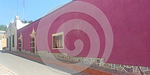 view of colorful house with pink wall in pueblo Zimapan Hidalgo Mexico photo