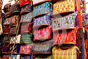 View of colorful indigenous maya bags with patterns on market in Chichicastenango, Guatemala