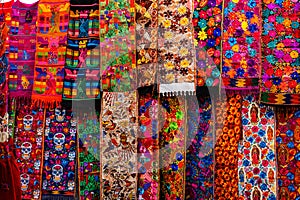 View of colorful indigenous maya fabric with different patterns on market in Chichicastenango, Guatemala