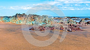 Colorful rock formations at Playa Lagarto, located near Pedasi in Panama photo