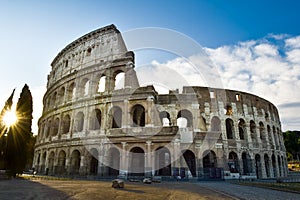View of the Colosseum in Rome and morning sun, Italy