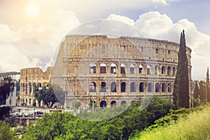 View of Colosseum in Rome and morning sun, Italy, Europe. Tourist attraction landmark