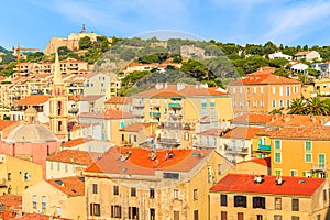 A view of colourful houses in Calvi port, Corsica island, France