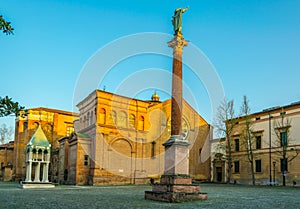 view of column with statue of Saint Dominic and Basilica of San Domenico, Bologna, Italy...IMAGE