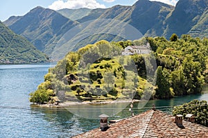 View of the Comacina Island with Saint Giovanni church on lake Como, Ossuccio, Italy