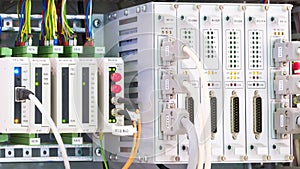 View of communication port module on PLC unit in control box of automation machine