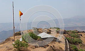 View of community meeting hall and the top view of Rajgad fort,