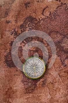 View of compass on ancient world map