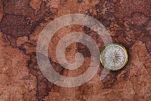 View of compass on old world map