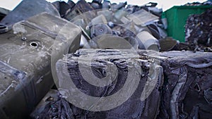 View of compressed metal waster on junkyard of recycling manufactory