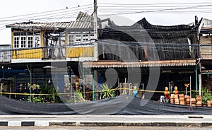 A view of the condition of a two-storey wooden house next to each other which was damaged